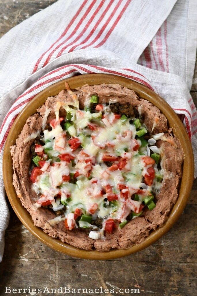 Taco pie with a refried bean crust