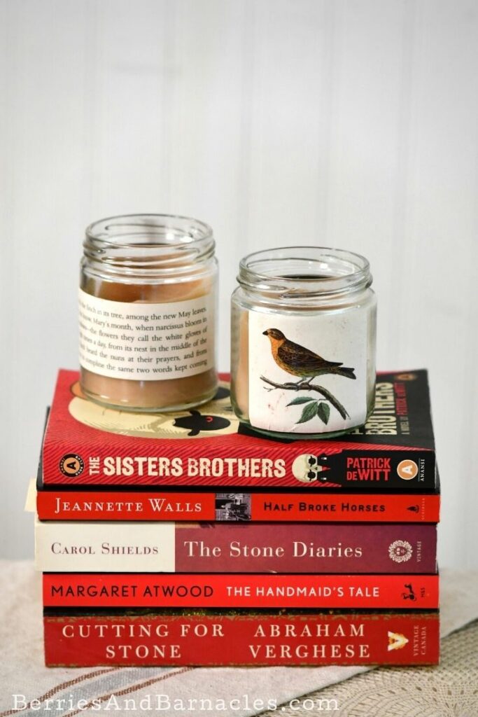 Stack of books with two homemade candle holders